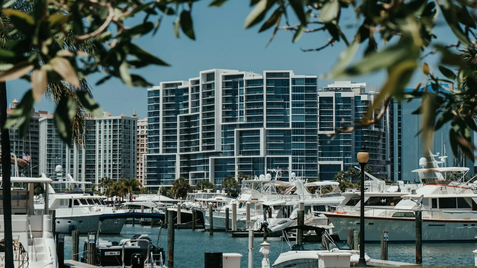 White modern residences above a marina