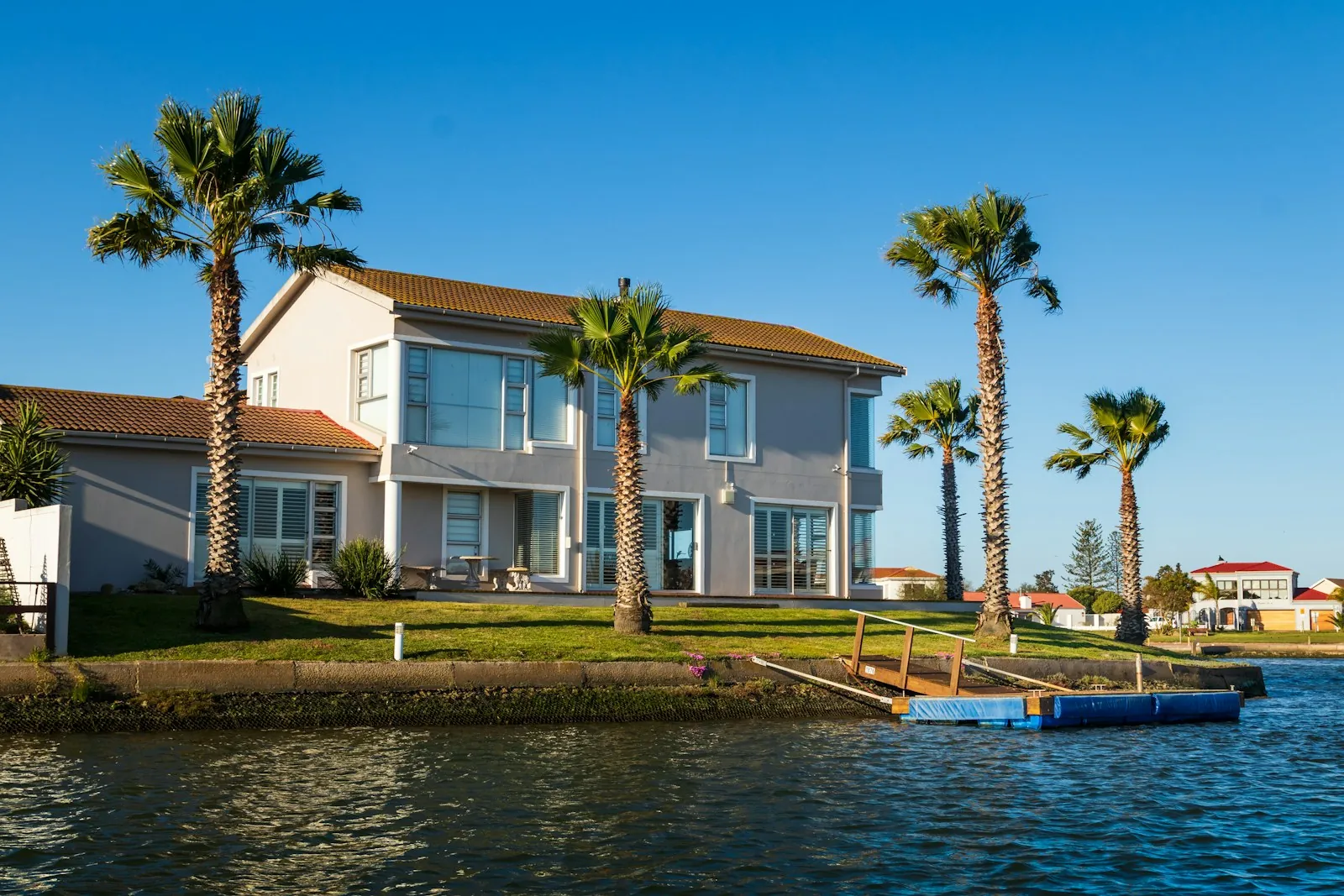 Waterfront residence with palms